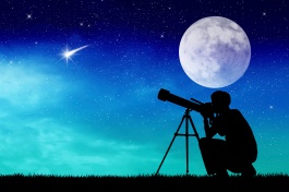 Man looks into the telescope